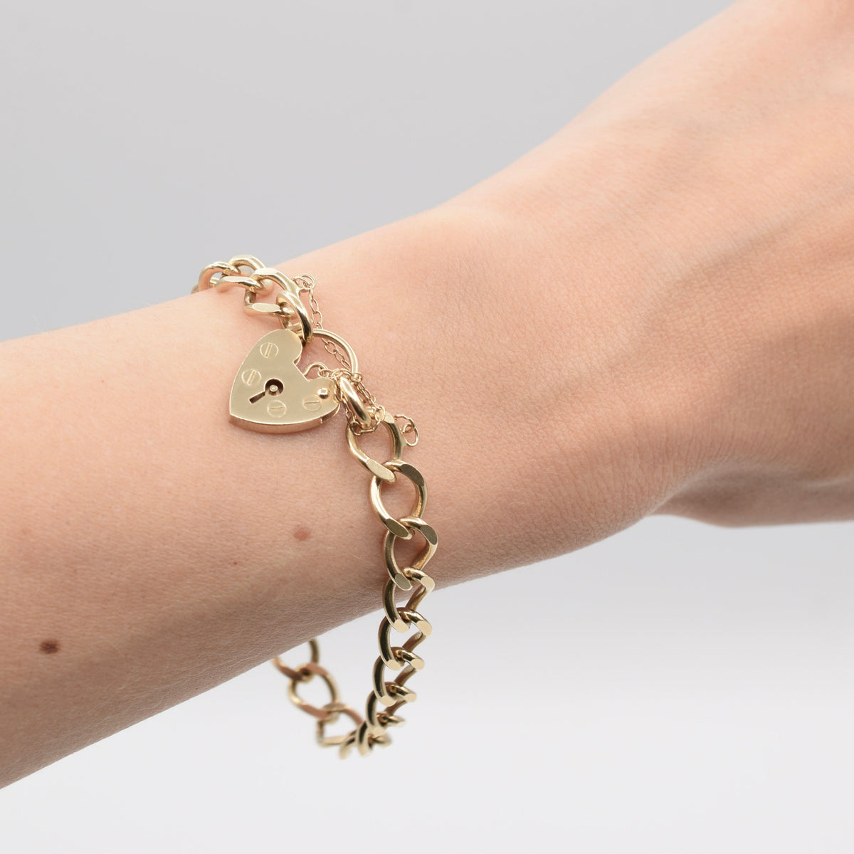 9K Flat Curb Link Charm Bracelet with Heart Padlock Clasp from 1990